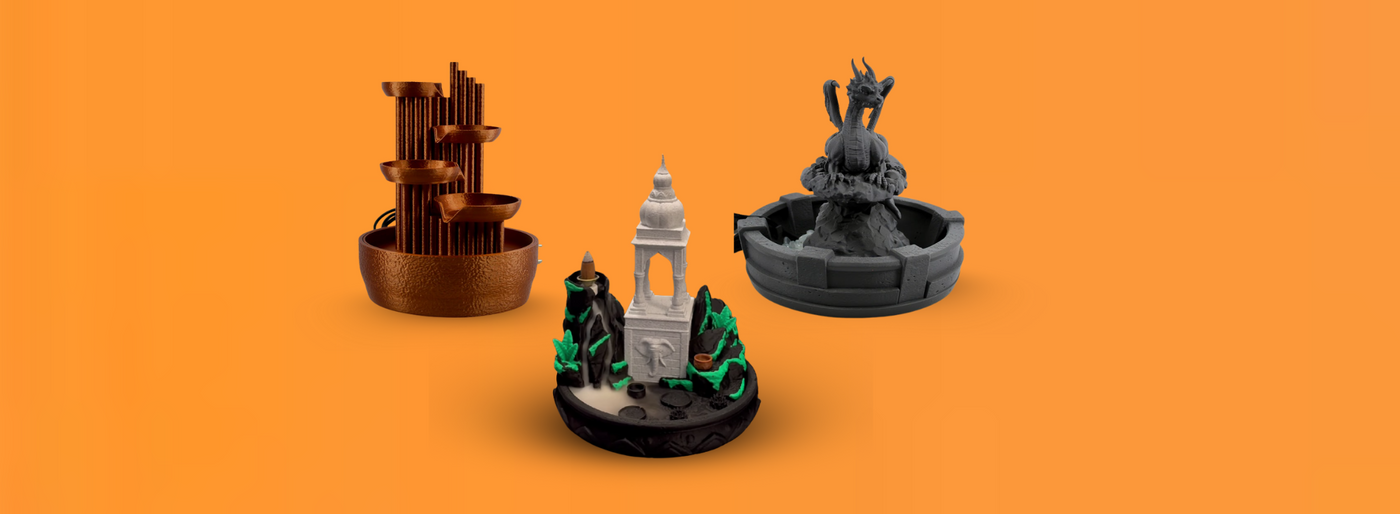 Four decorative figurines on an orange background